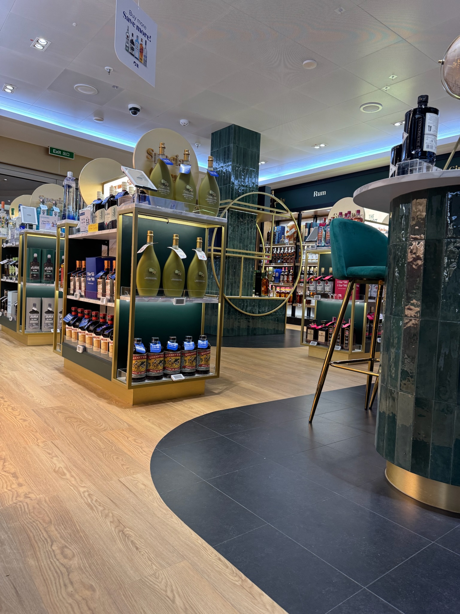 Modern cruise ship duty-free retail interior with bespoke fixtures and premium finishes by Ocean Outfit Ltd.